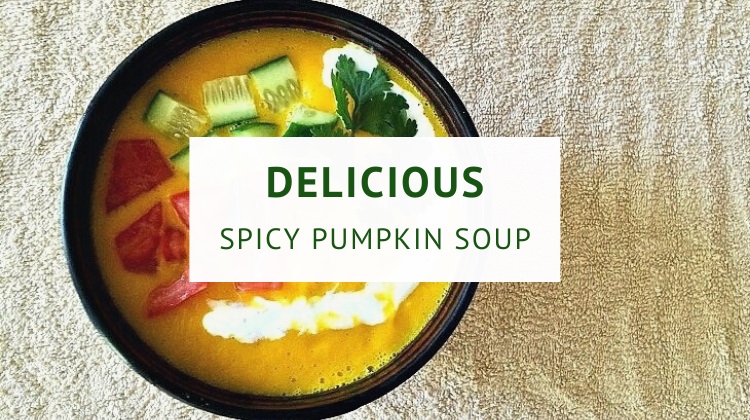 Spicy pumpkin soup topped with fresh garnish and yogurt