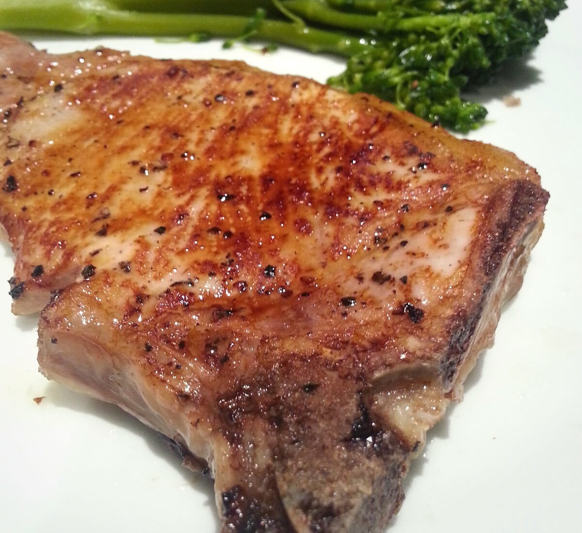 Oven baked bone-in pork chops with seasoning