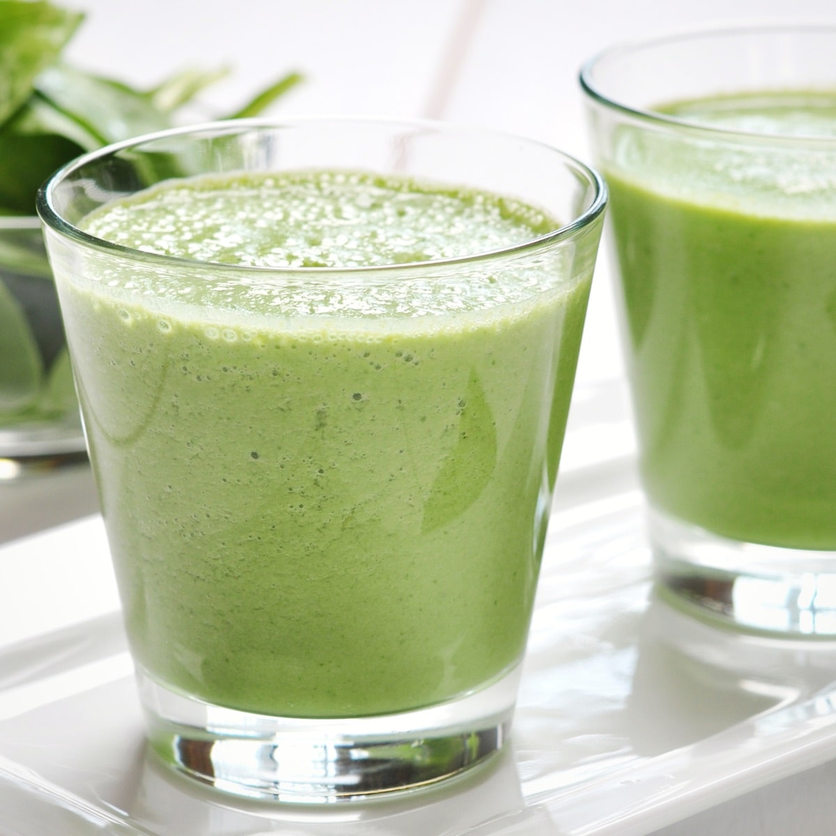 Green smoothie with avocado seed and spinach