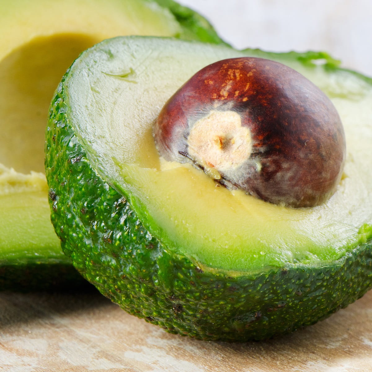 Avocado sliced in half with seed