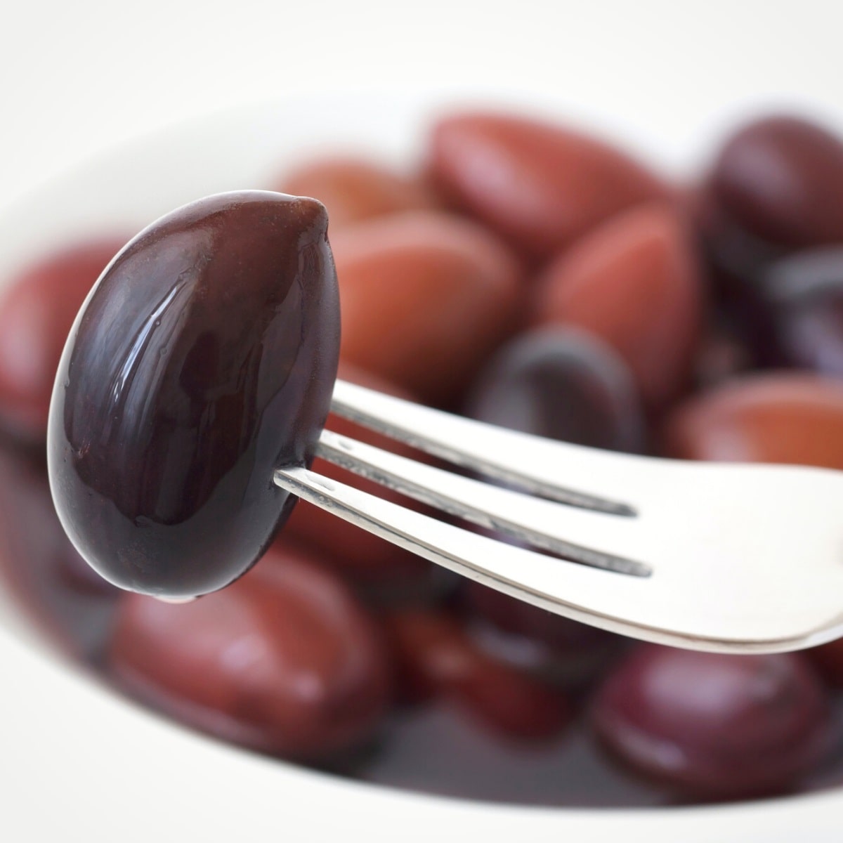 Kalamata olive on a fork